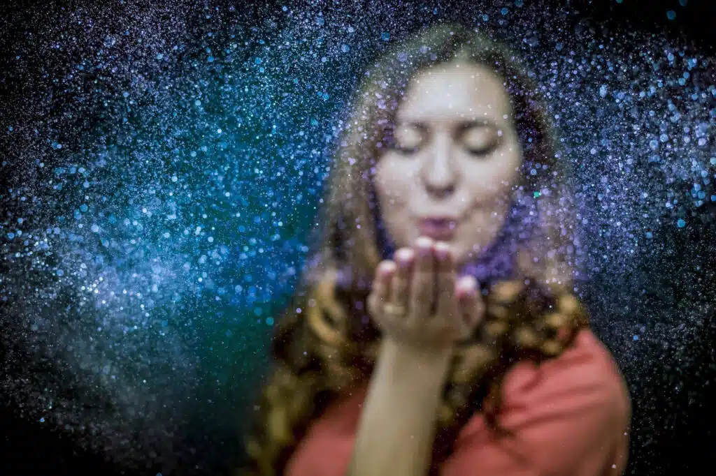 Woman blowing Neptunian space dust